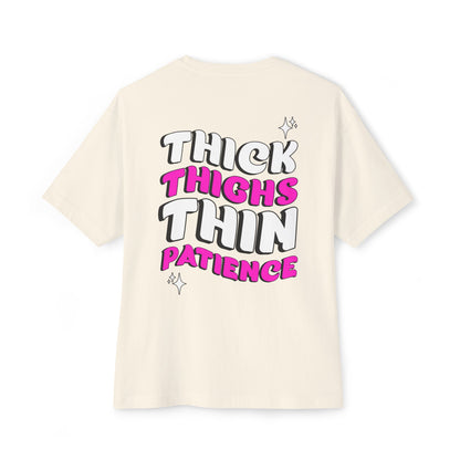 Beige t-shirt with 'THICK THIGHS THIN PATIENCE' text on a white background