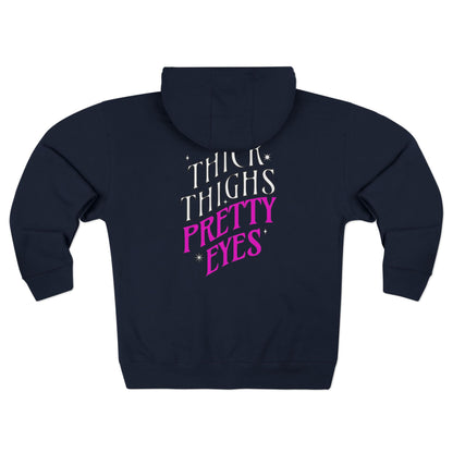 Navy hoodie with 'THICK THIGHS PRETTY EYES' text on the back against a white background
