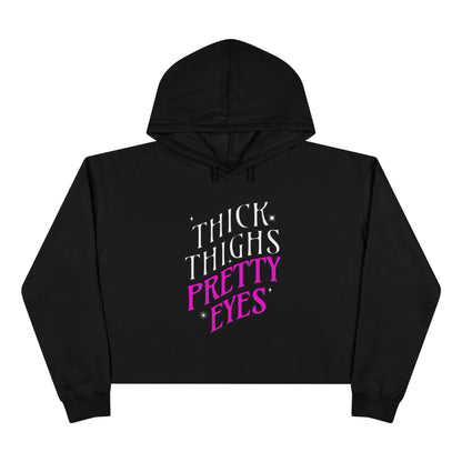 Black hoodie with 'THICK THIGHS PRETTY EYES' text on a white background